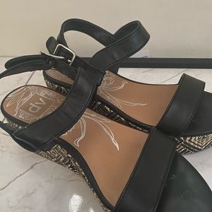 Chunky platform black sandals with detailed sole